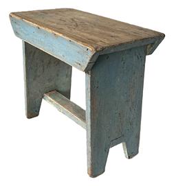 L52 Unique wooden splay leg stool bearing its original blue painted surface. Stool features a drop apron on each side, secured with small wire nails. Each leg is mortised into the underside of the top. A wide, chamfered edge brace is incorporated into the legs for added support. The underside of the top features chamfered ends that match the edges of the brace. Nice, sturdy stool. The wood is pine. Measurements: 17 ¾ long x 9 5/8 wide x 16 tall.  