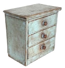 **SOLD** L114 Miniature late 19th century Pennsylvania set of Drawers featuring three drawers  retaining old dry blue-gray painted surface and original wooden knobs. This sweet little pine wood chest is small wire nail construction with chamfered and mortised drawer bottoms and hand-hewn marks on the back. Measurements: 10 wide x 6 deep x 9 ½ tall.  