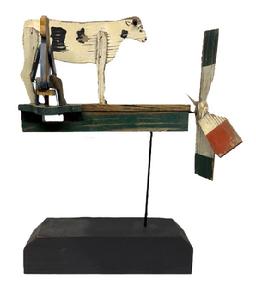 M168 Early 20th century Pennsylvania wonderfully detailed Windmill / Whirligig depicting a Man Milking a Cow in original paint including red, white, blue, green, black and yellow in good working condition. Circa 1930's. Mounted on a solid wooden base (new) for display purposes. Approximate measurements: ~16 long x ~14 tall. Overall mounted height is ~21 tall. Base measures 14 x 3 ½ x 3 ¼ tall.