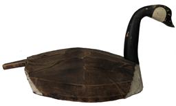 E560 Goose Decoy by Pat O'Neal (1897 - 1972) of Churches Island, NC in the heart of Currituck County where Market Gunning and Waterfowl hunting has been king since 1850.This Goose has canvas over wooden slats with a long paddle tail. Circa 1920