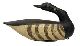 M230 Brandt Decoy in a preening pose - carved by Gary Crossman ( d 2007) of Chincoteague, Virginia. Decoy bears tack eyes and original painted surface with its original weight and staple intact on bottom. Measurements: 13 ½ long x 4 ½ wide x 7 ½ tall.