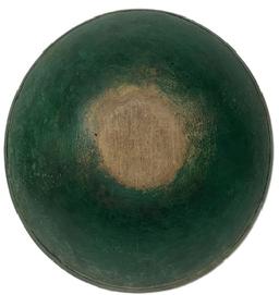 L343 Early 19th century New England wooden turned bowl retaining its old green painted surface. Bowl is slightly out of round, features a band around the rim and shows strong evidence of slow lathe turning on both the interior and exterior. Natural patina interior with a few age cracks that do not affect the integrity of the bowl. Great wear from years of use. Measurements: 15 ¼ x 14 ¼ diameter x 4 ¼ tall.