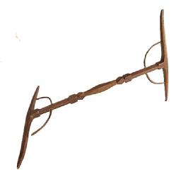 L405 Early 19th century handmade Niddy-Noddy yarn winder with decorative carved center shaft, steamed and bent supports for the fully mortised and pegged ends. Natural patina surface. Circa 1800-1810. Each end measures approximately 12 ¼ wide and overall length is 18 long. NOTE: These were essential items for hand spinners to wind yarn their newly spun wool yarn into skeins by repeatedly winding the yarn over, around and over the cross bars until it equaled twice the bars length to be considered a full skein.