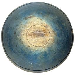 **SOLD** L489 Large, early 19th century hand turned solid wooden Dough Bowl bearing original dark blue painted surface with prominently lipped rim and evidence of slow lathe turnings throughout. Bowl rests on an ever so slightly footed base and retains great natural patina interior with wear indicative of years of use. Out of round. Extensive crack on each side (previously glued), one with an early make-do repair using wire staples. Measurements: 18 x 18 ½ diameter x 5 ¾ 6 1/8 tall (depending on where measured).