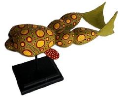 M291 Folk Art Carved Frog Decoy carved by Ryan Dockiewicz (b.1974) of Cape Charles, Virginia. Signed and dated 09 on bottom. This talented Virginia carver is known for utilizing his imagination to create Folk Art fish and decoy carvings featuring oversized eyes and brightly colored paint patterns. Mounted on a wooden stand for display purposes. Frog measures ~10 ¼ long x ~2 ¾ wide. Overall mounted height is ~5 ½ tall.