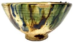 CM8 Spectacular tri-color thick glazed redware bowl on footed base featuring brown, blue and green on an ivory-color background. Measurements: 8 top diameter x 3 diameter footed base x 4 ¼ tall.