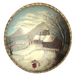 M103 19th century hand polychrome painted wooden bowl with a winter landscape scene of a house and barn inside a fence with a village and church is the distance. There is a bundled-up woman and child in the forefront. The woman is carrying a pack filled with sticks on her back. Unsigned. Slightly out of round with an age crack at the bottom of the painted scene. Measurements: 15 x 14 diameter x 3 ¾ deep.