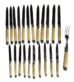 **SOLD** L352A Group of early Knife set and Meat Fork with carved ivory or bone handles and silver accents. Grouping includes (10) knives ~8 long, (12) knives ~9 ¾ long and (1) meat fork approximately 11 long. Very good condition with a few age / drying splits visible in the handles. The end cap of one of the 8 long knives has been replaced. Blades are sharp steel with no visible corrosion. Unmarked. Estimated to be from the Victorian era Circa 1850s-1880s.