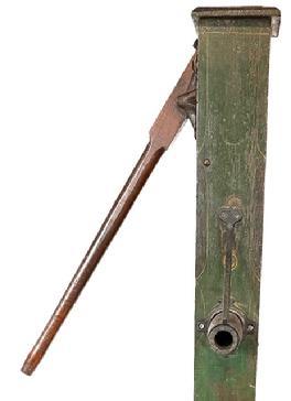 L228 19th Century Pennsylvania wooden hand pump retaining the original green and red paint with pin striping and paint decoration in red, mustard and black. The stenciled letters in mustard paint beneath the handle read: NOT GUARANTEED IF VENT IS PLUGGED. The pump is in outstanding condition and measures 70 ½ tall with cap and is 5 ½ square. The cap is 6 ½ x 7. It is 12 ½ deep at the spout.