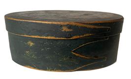 F33 Oval pantry box in the original dry green paint with three finger laps. Measurements are: 5 3/8" x 2" tall