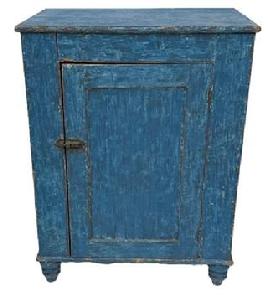 K1854 Mid-19th century York County, Pennsylvania one door cupboard with original blue painted surface and turned feet. The fully mortised door is surrounded with a crisp beaded edge and opens to reveal a clean, natural patina interior. Case is dovetailed at the bottom. Circa 1850s. The wood is pine. Great size! Measurements: 29 ¼ wide x 19 ¾ deep x 37 ¾ tall.