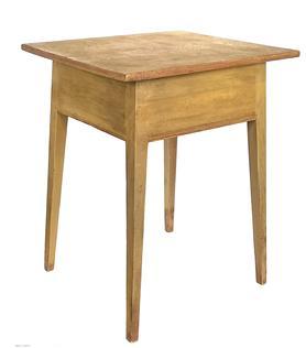 J140 Pennsylvania Hepplewhite table with old mustard painted surface over the original red paint boasting tall, gracefully tapered splay legs. Mortised and wooden pegged construction with carved reeded detailing along the bottom edge of the apron on all sides. Circa 1820s 1850s. One-board top. Measurements: 21 ½ x 24 ¼ x 30 ½ tall.