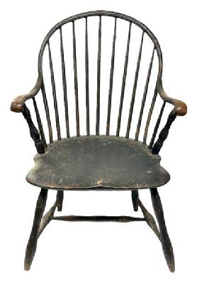 M241 Late 18th century Delaware Bow-back Windsor armchair retaining beautifully worn black over original salmon painted surface. Sturdy steamed and bent arms end in carved knuckle handholds. One board seat. Nice turnings. Great wear especially on each of the arms and seat front. The chair measures 22 wide across front of arms. Seat is 17 ¼ deep x 19 wide x 16 ½ tall from floor. Overall height of chair back is 37 tall.