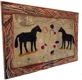 F165 Late 19th century Double-Horse Hooked Rug, Pennsylvania , it is rare and desirable to see two horses on the same rug. The standing pose is further energized by the boarder, of different colors 41 3/4" wide x 27 1/4" tall ,
