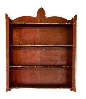 L96 Unique 19th century hanging wall shelves with shaped sides and shaped cutout on back retaining the original red painted surface. Unusual gold gild molded insert edges adorn the shelf fronts and each front corner. Small wire nail construction. The woods are pine and poplar. Circa 1870-1900. Measurements: 26 wide x 6 3/8 deep x 33 ½ tall (back center).  