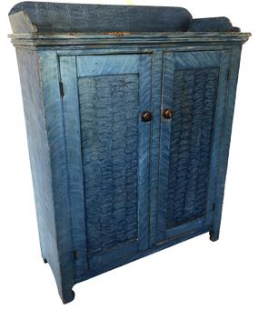 E250 Gorgeous Chester County, two door storage cupboard with blue paint decoration. Applied splayed and shaped dovetailed gallery. Clean natural interior nice high cut out foot, solid ends Beautiful c. 1820Pine Ht. 55 1/2” W. 43 1/2” D. 17 3/4”