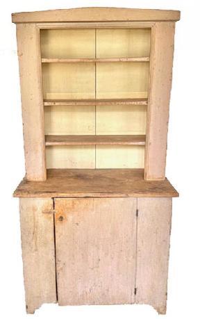 E107 Early 19th century Pennsylvania open top two-piece Stepback Cupboard in old dry salmon paint over the original blue/ gray. One board white pine with square head and �T� nail construction. Circa 1810 -1820s. Single batten door, with nice high cut-out feet. The top has applied molding and a molded beaded edge around opening. Measurements are: 18 &frac34;� deep x 35" wide x 67 &frac12;� tall. 