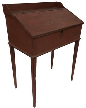 E564 Early 19th Pennsylvania Original Red Painted Slant Top Desk Fantastic 19th century original red slant top primitive desk.This desk has the best old worn surface.The interior has three little dovetailed drawers with original brass pulls, surrounded by pigeon holes .The tall taper legs are wonderful form with applied waist molding.Top of desk has a applied dovetailed gallery. measurements 33” wide 45 1/2” tall 20” deep