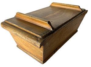 K1825 19th century Pennsylvania lidded dough box in original mustard grain painted surface. Dovetailed and square head nail construction with lid that retains two original grasp battens. Clean, natural patina interior. Applied curved molding on each end acts as sturdy handles. The wood is pine. Circa 1870s-1880s. Measurements: 27 ½” long x 14 ¾” wide x 9” tall sides x 11” tall at battens.