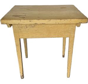 L541 Late 18th to early 19th century Pennsylvania pin top worktable with an extra thick one-board top and mortised and pegged apron resting on sturdy, gradually tapered legs bearing its original creamy pale-yellow painted surface. The top is attached to the base via a stretcher beneath each side that is mortised/dovetailed into the top and attached to the base with thick wooden pegs (see photos). These stretchers kept the top from twisting/warping over time. The top is actually one board that has split across the center from age. The apron is fully mortised and pegged into the gracefully tapered legs. The wood is pine. Measurements: 30 ¼ wide x 24 deep x 30 ¾ tall. The top is a full 1 5/8 thick. The boards that make up the apron are a full 1 thick. Clearance from apron to floor is 22 ½.