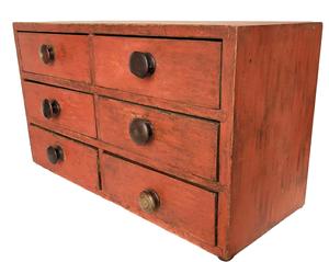 E557 Mid 19th Century Pennsylvania Apothecary drawers retaining it’s original red paint. Six dovetailed drawers in a square head nailed case, the drawer dividers are mortised in to the case. Measurements are 24” wide 13 1/4” tall 10” deep