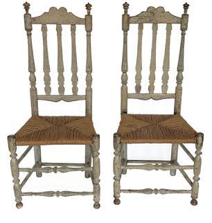 L53 Rare pair of 18th Century New England William & Mary style triple Banister Back side chairs with rush seats, great carved crests and delicate turned finials. Both chairs bear original old multi-layer painted surfaces. Circa 1740s-1760s. From Connecticut. Measurements: 19 across fronts x 14 ¼ deep x 43 ½ tall (back) x 17 tall (seat height).