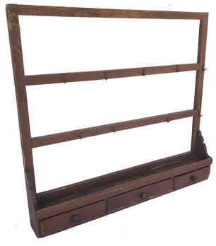 E230 COUNTRY PAINTED DRYING RACK, three rails mortised through end posts with ten wrought iron hooks, applied to a lower shelf with three drawers. Retains a red-painted surface. Second half 19th century. 35 1/2" H, 39" W, 5 1/2" D.
