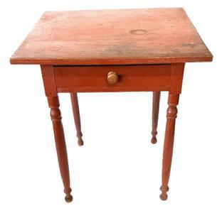 L218 Early 19th century Lancaster County, Pennsylvania turned leg side table with one dovetailed drawer. Original red painted surface with a pegged on top and gracefully turned legs resting on turned ball feet. The drawer is dovetailed front and back. Legs and apron are mortised. The wood is walnut. Measurements: 25 ¾ wide x 23 ½ deep x 29 ½ tall.