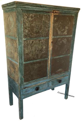 D517 Early 19th century twelve star tin Pie Safe, from Western Maryland, in the original blue paint, two doors,over two drawers, the tins are all hand punched, circa 1820 Measurements are 16 1/4" deep x 37 1/4" wide x 56 1/2"