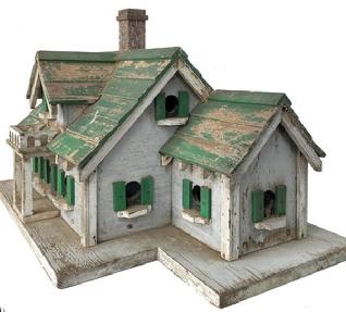 F98 Early 20th century South Carolina Folk Art Carved and Painted two Story Bird House Circa 1920. with eleven compartment. A lot of detail and workmanship with into making the Bird House