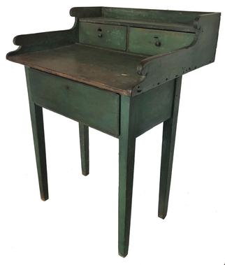 E401 Rare Eastern Shore, Caroline County Maryland painted pine Ships Captains desk, 19th c., retaining original green painted surface, with unusual overhanging top with scrolled sides, having two drawers over a base with a single drawer, The unusual over-hanging form, was to fit and to be secured the rounded hull of the boat. 36 1/2" h., 25 1/2" w., 23" d.