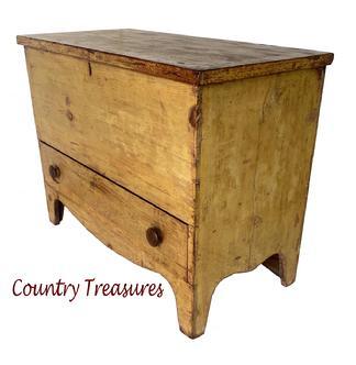 Mid 19th Century Western Pennsylvania Chest over Drawer – or “Mule” Chest – in original yellow paint with one dovetailed drawer, beautiful high cut out feet. The case is all square head nail construction with two wide boards for the back and applied molding around the top. The inside is very clean. The primary wood is white pine with the secondary wood in the drawer being chestnut – indicative of the Western Maryland and Pennsylvania region. The chest retains its original lock, however the key is missing. Very unusual to find a Mule chest in this appealing color and size! Measurements: 38 1/4” wide x 18 3/4” deep x 29 1/2” tall