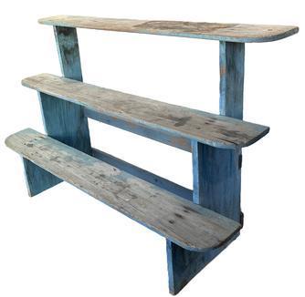 K93 19th century Pennsylvania set of shelves / bucket bench / plant stand having three tiered shelves bearing original blue painted surface with great wear from years of use. Square head nail construction with one of the supports across the back being mortised into the sides. Circa 1860s 1880s. Measurements: 48 wide x 17 ½ deep x 31 ¼ tall