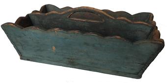 E519 Late 18th Century Lancaster Co Pennsylvania Cutlery Caddy / knife box retaining it’s original dry blue painted surface, with a canted form and scalloped side and cut out handle. Tee nailed construction, Circa 1790 Measurements are:14" long x 9 1/2" x 5 1/2" tall