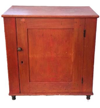M146 Mid-19th century York County, Pennsylvania one door cupboard with original red painted surface and turned feet. The fully mortised door is surrounded with a crisp beaded edge and opens to reveal a clean, natural patina interior with sturdy shelves. Pine, one board square head nail construction. Circa 1850s. Measurements: 31 wide x 20 deep x 31 ¾ tall.