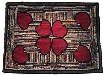 F78 Vintage Hooked Rug with red hearts. Look closely at different shades of black, gray, white and muted pink background. This hooked Rug is from the 1940-50's. There is a red heart in each corner, and 4 in the center . It has been cleaned and mounted. The total size of the rug is 45" wide x 35"tall.