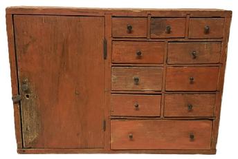 **SOLD** M264 Mid 19th century New England Apothecary Cabinet featuring a very unusual layout with a hinged door to the left with interior shelf and a series of ten (10) drawers to the right in a 3 over 2 over 2 over 2 over 1 configuration, with the top 3 drawers having divided interiors. The case and drawers are dovetailed construction with the drawer stretchers/dividers being mortised. The woods are pine and poplar. Extensive mouse/rodent holes and related damage to back and interior of drawers. Measurements: 30 wide x 8 deep x 21 ¼ tall.