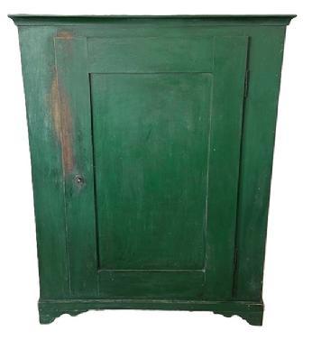 L535 19th century Lancaster County, Pennsylvania one door storage cupboard retaining old green painted surface over original red paint. Dovetailed case with applied molding surrounding the top and resting on dovetailed applied feet with nice cut out. Mortised door opens to reveal a clean, natural patina interior. The wood is poplar and pine. Circa 1850s. Measurements: 41 &frac14;� wide x 20� deep x 53 &frac14;� tall. 