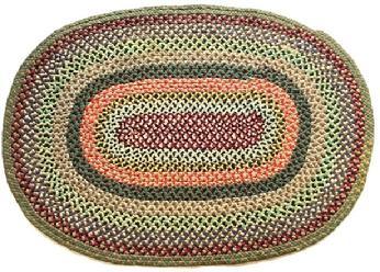 RM1453 Handmade oval braided rug – mixed wool fabrics with a burgundy center, red/tans, a hint of yellow and greens around the outer edge. Very nice condition. Measurements: 50 1/4" x 36".
