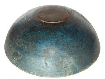 **SOLD** L137 Outstanding large, original dry blue painted 19th century turned wooden bowl from a private new England Collection with slightly raised footed base boasting beautiful original blue painted surface showing great wear from years of use. Natural patina interior. Evidence of slow lathe turnings throughout. Sturdy bowl with age cracks to rim that do not affect the integrity of the bowl. Measurements: 16 ¾ x 18 diameter x 5 ¼- 5 ½ tall, depending on where measured.