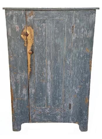 **SOLD** L291 Nice 19th century Pennsylvania one door cupboard bearing original old blue / gray  over original red painted surface. Great wear. The paneled door opens to reveal a clean, natural patina interior with shelves for added storage options. The wood is pine, square head nail construction. Circa 1850s-1860s. Measurements:  39 &frac14;� wide x 18 &frac12;� deep x 59 &frac34;� tall. 