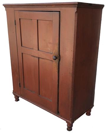 LD1 Early 19th century Lancaster County Milk Cupboard, with original dry red paint, dovetailed case top and bottom, single door with four nice champhered panels,mortied and pegged, with the original red paint inside of the door.. Lamb tongue corner, with the original mushroom turned knob, beautiful turned feet.circa 1800- 1820