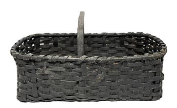 RM1649 Large rectangular 19th century gathering basket in original black paint. This sturdy woven basket boasts double steamed and bent rims that are single wrapped, a thick, steamed and bent handle that is notched and woven into the sides of the basket, and thick steamed and bent slats on each end of the bottom that are woven into the sides and act as feet for the basket to rest on. Minor losses from age and use, but still a sturdy basket that displays beautifully. Measurements: 27" long x 18" wide. Sides are ~8- 9 tall, depending on where measured. ~14 tall at handle.