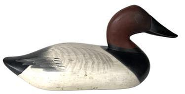 K159 Canvasback Decoy carved by Madison Mitchell (1901-1993) of Havre De Grace, MD in original paint. Decoy is branded "L H C" in three locations on bottom. Missing the staple, ring and weight.