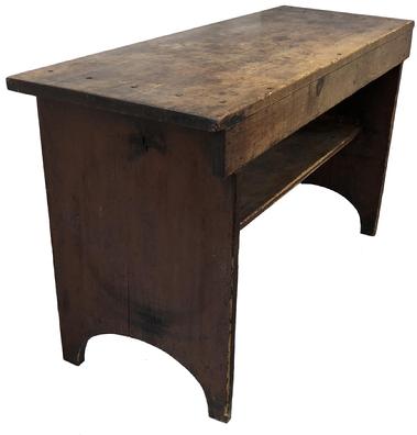 E314 Early 19th century Lancaster County Pennsylvania, Bucket bench, retaining it's original dry red paint surface. Very unusual form, having a 3/4 shelf below, high arched cut out ends, one board white pine square head nail construction. circa 1820 Measurement 50 1/4" wide x 18" deep x 28" tall