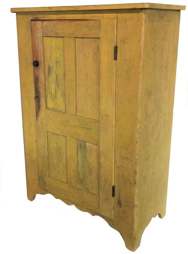 F41 19th century one door Storage Cupboard from Lancaster County Pennslyvania, beautiful early yellow paint, the door is four panels that is full mortised and pegged, with a high cut out foot, all natural oatina on the inside circa 18 20. Measurements are 18 1/2" deep x 38" wide x 54 1/4" tall