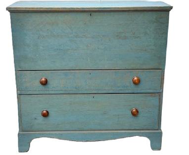M118 18th century Massachusetts original blue painted chest over drawers resting on a tall, cut out bracket base. The lift lid features applied molding around the edges and opens to reveal a clean, natural patina interior. Both drawers have beaded edge fronts and are dovetailed construction. The drawer stretchers are also dovetailed. Three wide backboards are secured with T nails. Circa 1780s. Measurements: 43 ¼ wide x 18 ½ deep x 43 ¼ tall.