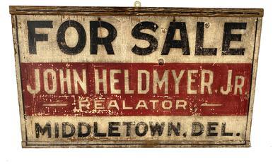G151 Early 20th century wooden trade sign for "John Heldmyer. Jr. Realator Middletown DE " painted on single board with bread boad ends, with white background and black and red as the other colors