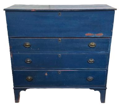 L470 Early 19th century New England Mule Chest with old blue painted surface featuring hinged lift lid storage area over three dovetailed drawers with beaded edges and original hardware, resting on tall cut out feet. Applied battens on underside of lid. The wood is pine with square head nail construction. Natural patina interior. Circa 1800-1820. Measurements: 42 ½ wide x 18 ½ deep x 42" tall.
