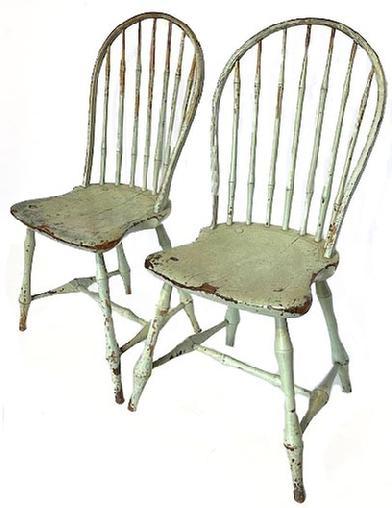 K1851 Pair of early 19th century Pennsylvania seven spindle bow back Windsor chairs bearing original painted surfaces. Circa 1800-1820. All original. Measurements: 16 ½ wide across fronts x 15 ¾ deep x 37 tall back. The seats are 17 ½ tall.